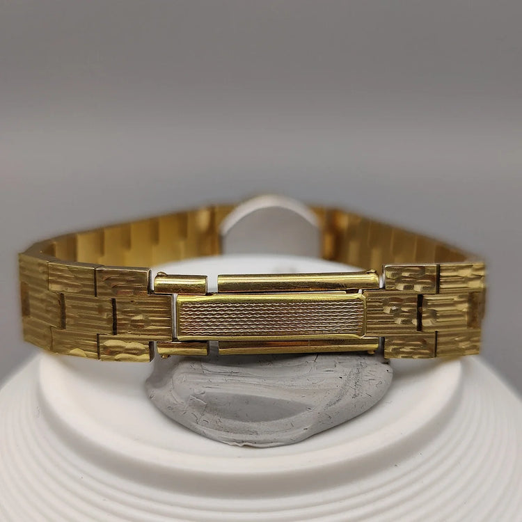 Fermoir d'une montre Rotary Incabloc 1970 vintage, détail clé pour montre automatique ou manuelle de collection.