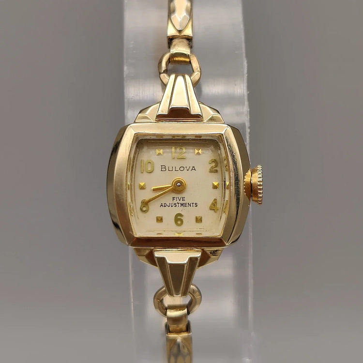 Bulova Cocktail Watch 1960, vue du boîtier. Montre vintage femme élégante, cadran champagne, 16mm.