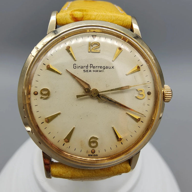 Boîtier Girard-Perregaux Sea-Hawk vintage 1960, mouvement manuel, cadran champagne.