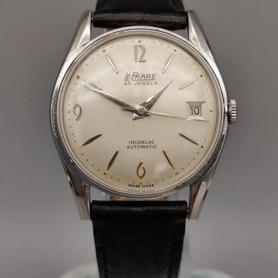 Cadran de la montre Le Phare Automatic Incabloc de 1965. Une montre automatique vintage au cadran champagne.