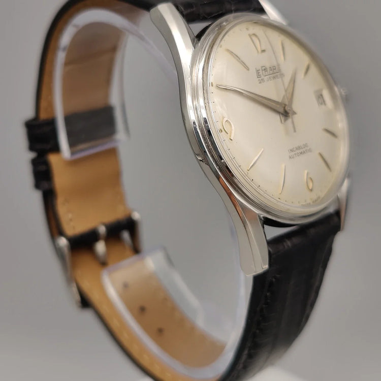 Montre Le Phare Automatic Incabloc 1965 vintage, cadran champagne, vue de profil. Montre automatique femme.