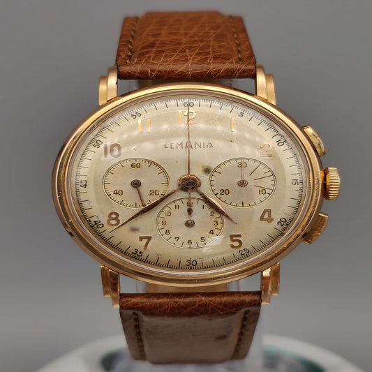 Boîtier Lemania Chronographe vintage 1950, mouvement manuel, cadran champagne. Montre de collection.