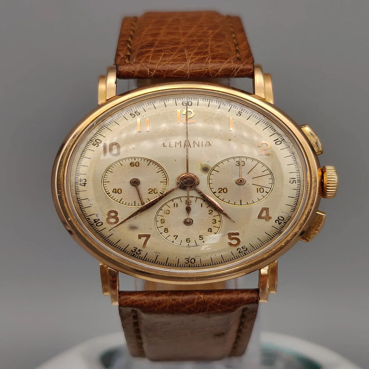 Boîtier Lemania Chronographe vintage 1950, mouvement manuel, cadran champagne. Montre de collection.