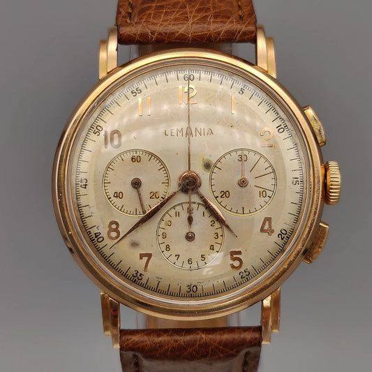 Boîtier détaillé du Lemania Chronographe vintage 1955. Mouvement manuel, cadran champagne. Montre de collection.