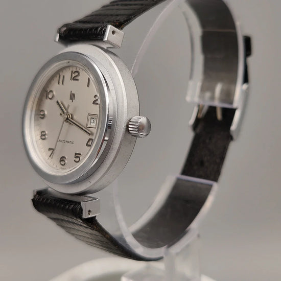 Couronne authentique d'une montre vintage Lip Automatic 1972, mouvement automatique, cadran argenté.