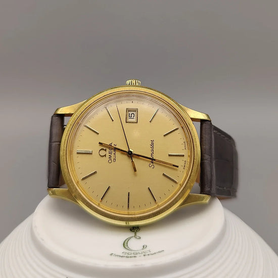 Cadran Omega Seamaster De Ville automatique vintage 1965, couleur champagne, vue détaillée.