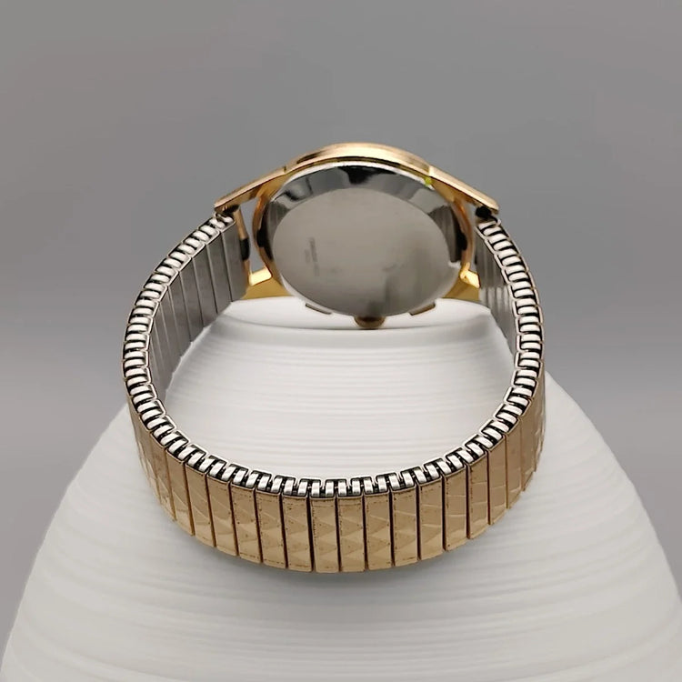 Montre vintage Telda Meangraf 660 FT de 1950, cadran noir, mouvement manuel, photo sur fond neutre.