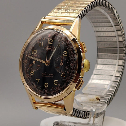 Montre vintage Telda Meangraf 660 FT (1950) au cadran noir, vue rapprochée de la couronne.